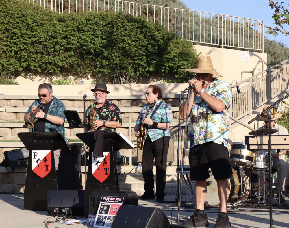 Flat Top Tom and His Jump Cats play blues music for the audience at the Valencia Marketplace Summer Concert Series in Valencia, Friday, Aug. 29, 2025. Kamryn Martell/The Signal