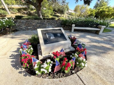 Marking the 25th anniversary of Dep. Jake Kuredjian’s line-of-duty death, new planted flowers and small American flags refresh the memorial site in Stevenson Ranch, Aug. 31, 2025. Michael Picarella/The Signal