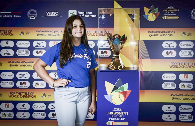 Nylah Melendez with the WBSC trophy at an event news conference for coaches and team captains. Photo Courtesy of WBSC