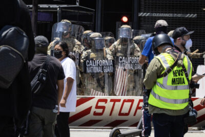 Protesters confront federal agents and California Army National Guardsmen in Los Angeles on June 8, 2025. Photo by John Fredricks.
