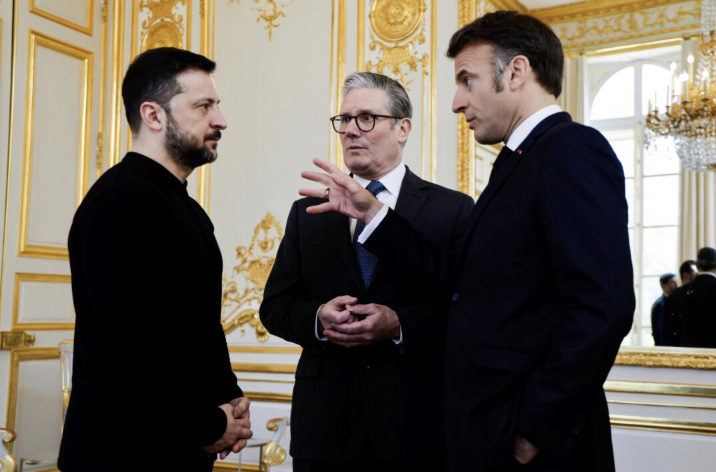 Ukrainian President Volodymyr Zelenskyy, (L), French President Emmanuel Macron, (R), and British Prime Minister Keir Starmer (C) speak during a meeting at the Elysee Palace, in Paris on March 27, 2025. Ludovic Marin, Pool Photo via AP