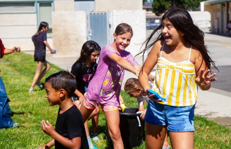 Children participate in a water fight during the 50th birthday celebration for Meadows Elementary on Sept. 5, 2025. Katherine Quezada/The Signal