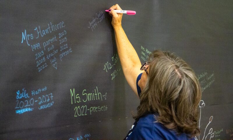 Teachers write their names to commemorate their time at Meadows Elementary during the 50th birthday celebration on Sept. 5, 2025. Katherine Quezada/The Signal