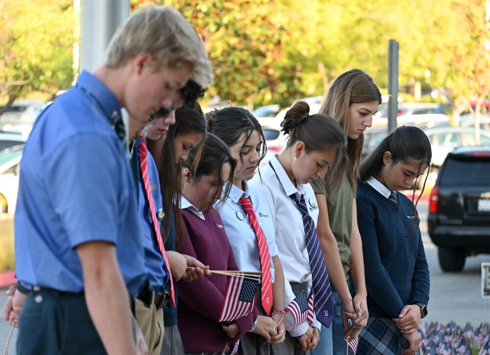 Students bow their heads during a 9/11 remembrance event at Trinity Classical Academy in Valencia, Sept. 11, 2025. Michael Picarella/The Signal