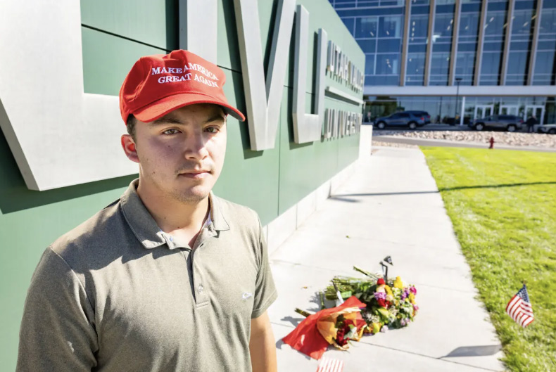 Utah Valley University student Koby Herrera stands near flowers place im memorial of Charlie Kirk in Orem, Utah, on Sep. 11, 2025. Photo by John Fredricks.