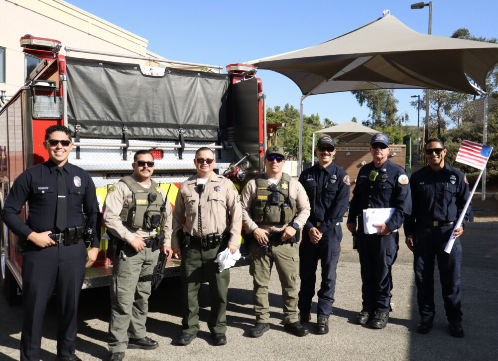 First responders from the Santa Clarita Valley Sheriff's Station and Fire Station 143 pose for a photo at the "SCVi First Responders" assembly at SCVi in Castaic, Thursday, Sept. 11, 2025. Kamryn Martell/The Signal