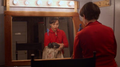 Janaé Rachel Ballot takes a look in the mirror at herself during a scene in her movie “Dissociated Me.” Photo courtesy of Janaé Rachel Ballot