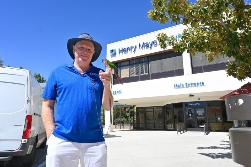 Portrait of Charles Davis and his therapy bird, Glory, at Henry Mayo Newhall Hospital in Valencia, Sept. 5, 2025. Michael Picarella/The Signal