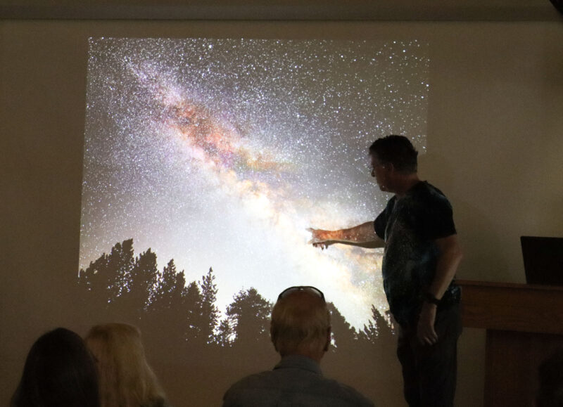John Favalessa, astrophotographer, points to his photo at the "Deep Space Shots" event at the Placerita Canyon Nature Center in Newhall, Sunday, Sept. 14, 2025. Kamryn Martell/The Signal