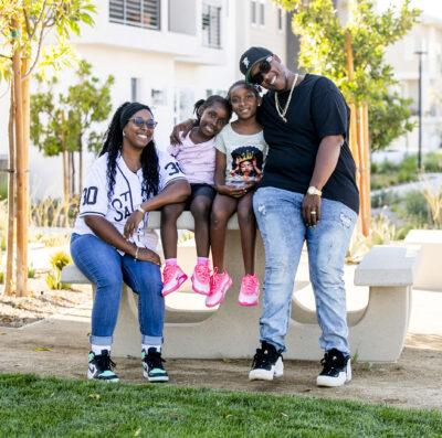 Amber and Quinten Branch with their daughters Harriet, center left, 6 and Harriet, 9, embrace their new home in FivePoint on Wednesday, Aug. 27, 2025. Habeba Mostafa/ The Signal