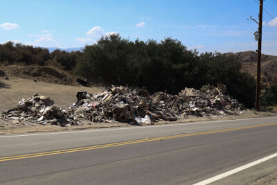 A person dumped a truckload of trash illegally on Placerita Canyon Road in Newhall, Calif., Monday, Sept. 29, 2025. Kamryn Martell/The Signal