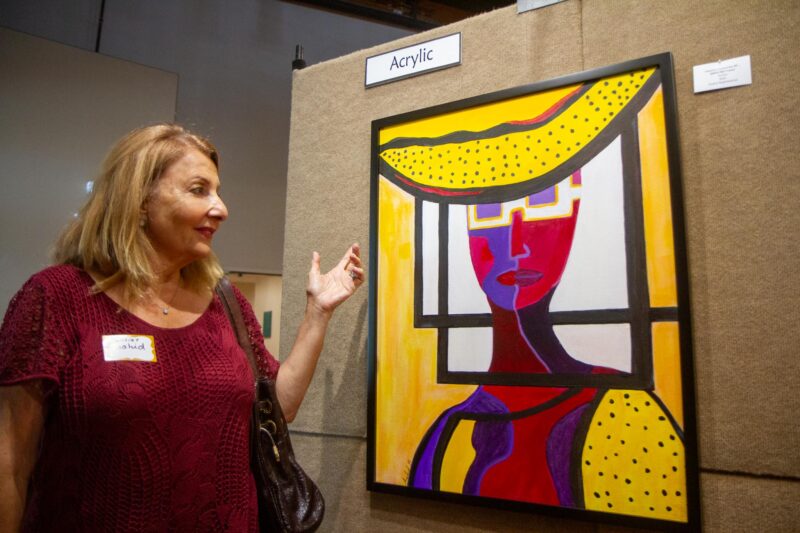 Artist Anahid Baghdasarian with her original acrylic art piece “Within the Frame” at the 35th annual Art Classic hosted by the Santa Clarita Artists Association on Sept. 27, 2025 at The Centre. Katherine Quezada/The Signal