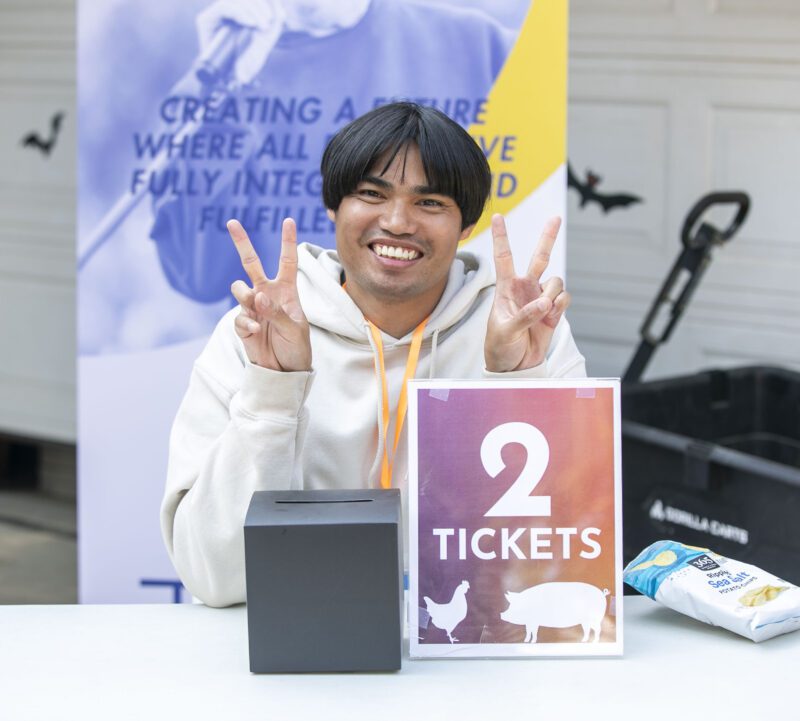 TASC employee Nico De Guzman sells tickets during Fall Festival on the Farm in Sand Canyon on Saturday, Sept. 27, 2025. Habeba Mostafa/ The Signal