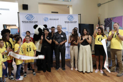Local dignitaries, Panda Express members, Santa Clarita Valley Boys & Girls Club members and staff participate in the ribbon cutting during the Panda Cares Foundation Center of Hope ceremony at the Santa Clarita Valley Boys & Girls Club - James T. Ventress Clubhouse in Newhall, Wednesday, Sept. 24, 2025. Kamryn Martell/The Signal