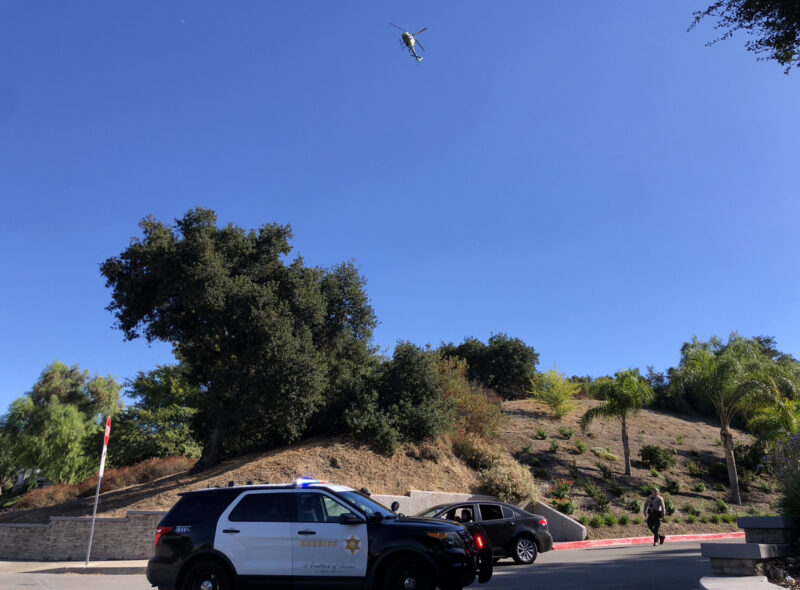 Deputies and air units search for a suspect after stealing a vehicle on the intersection of Valle Del Oro and Newhall Avenue on Sunday afternoon. Courtesy photo of Oscar Sol.