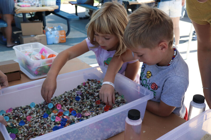 Mila Gladchenko, 5, and Niko Gladchenko, 7, search for prizes at the 23rd annual Duck Dash at the Santa Clarita Aquatic Center, Sunday, Oct. 5, 2025. Kamryn Martell/The Signal