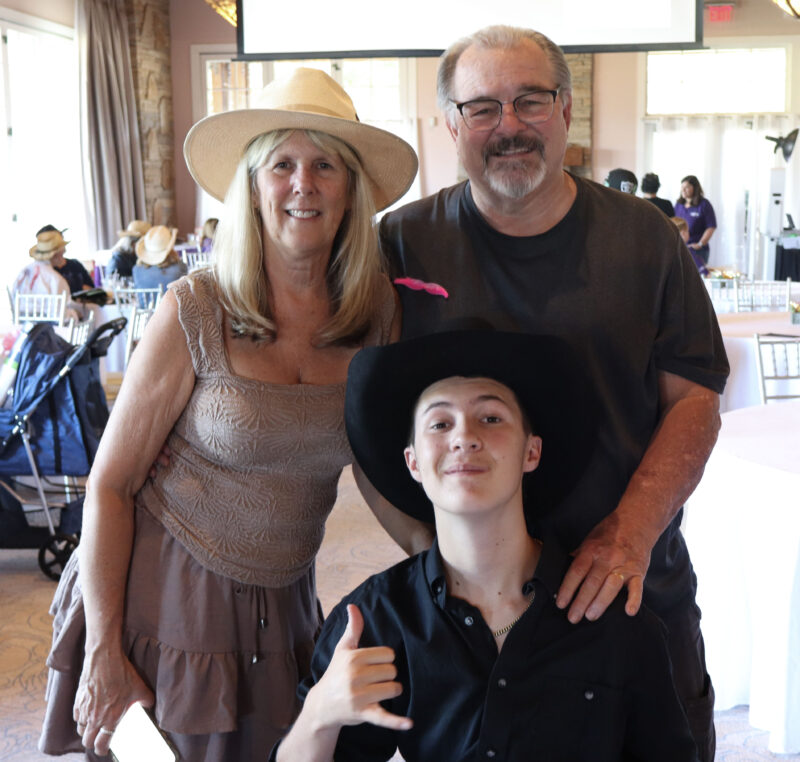 Tami Carmody (L), Talon Carmody (C), 14, and Todd Carmody (R) pose for the camera at the Titania K9 Fund "Wanted: Wild West" Gala at the Sand Canyon Country Club in Canyon Country, Sunday, Oct. 5, 2025. Kamryn Martell/The Signal