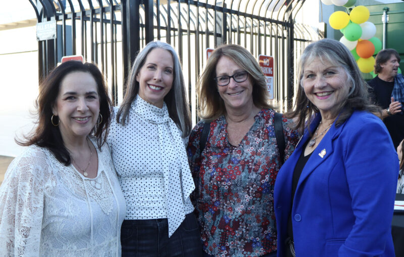 Hillary Broadwater (L), Nikki Buckstead (CL), Cathy Craig (CR), and Kathy Norris (R), who are business leaders, smile for the camera at the Valley Industry Association mixer for the Santa Clarita Valley Food Pantry's 40th anniversary at the SCV Food Pantry in Newhall, Calif., Thursday, Oct. 2, 2025. Kamryn Martell/The Signal