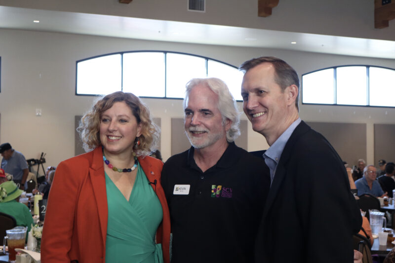 Assemblywoman Pilar Schiavo (L), D-Chatsworth, Kevin MacDonald (C), CEO of the Santa Clarita Valley Senior Center at Bella Vida, and U.S. Rep. George Whitesides, D-Agua Dulce, smile for a photo at Schiavo's third annual Senior Resource Fair at the Santa Clarita Valley Senior Center at Bella Vida, Thursday, Oct. 9, 2025. Kamryn Martell/The Signal