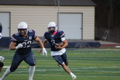 Trinity running back Aiden Visconti running down the field during the game at Cougar Stadium on Oct. 11, 2025. Ryan Romero/The Signal
