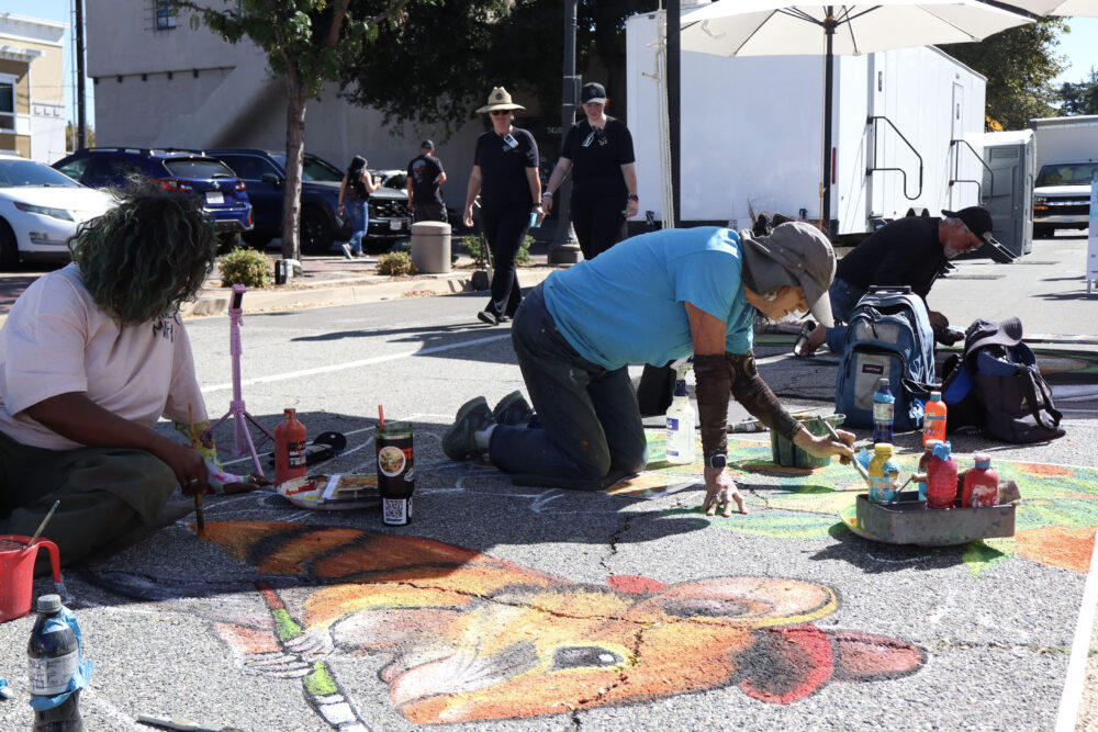 Chalk artists draw pictures live at the Old Town Newhall Fine Art Festival on Main Street in Newhall, Calif., Sunday, Oct. 12, 2025. Kamryn Martell/The Signal