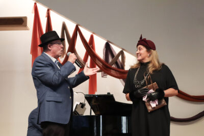 Ed Hill performs "Luck Be a Lady" from the musical "Guys and Dolls" to Leslie Garman at the "It's a Grand Night for Singing" concert by the Santa Clarita Master Chorale at the Valencia United Methodist Church in Valencia, Calif., Sunday, Oct. 12, 2025. Kamryn Martell/The Signal