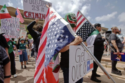 A man wears a Mexican wrestling mask at the No Kings protest at Akard Plaza in Dallas, on June 14, 2025 Photo by Bobby Sanchez.