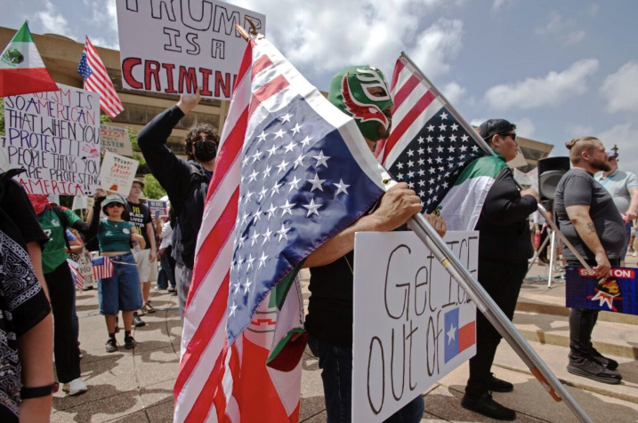 A man wears a Mexican wrestling mask at the No Kings protest at Akard Plaza in Dallas, on June 14, 2025 Photo by Bobby Sanchez.
