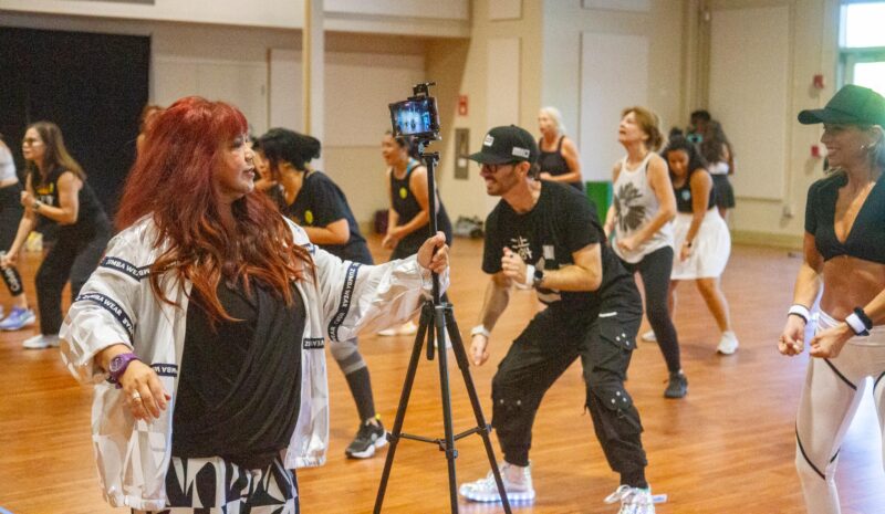 Jocelyn Reyes with Santa Clarita Sister Cities records Zumba dancers at the annual fundraiser to helo fund future projects on Oct. 11, 2025 at The Centre. Katherine Quezada/The Signal