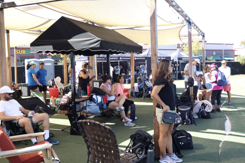 Attendees watch the participants play pickleball at The Michael Hoefflin Foundation “Paddle for the Battle” pickleball fundraiser at The Paseo Club in Valencia, Calif., Sunday, Oct. 12, 2025. Kamryn Martell/The Signal