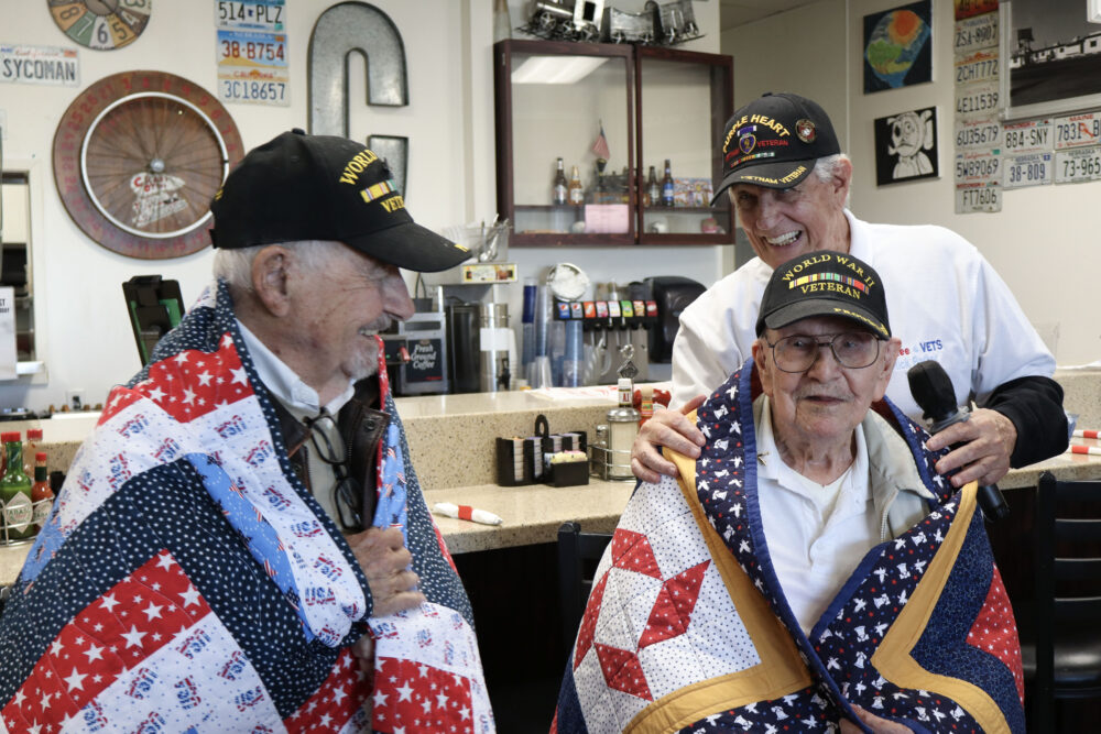 Ken Placek (L), Don Kuehl (C) and Rick Barker (R) laugh with each other at the Coffee 4 Vets gathering at Crazy Otto's Diner in Canyon Country, Calif., Thursday, Oct. 16, 2025. Kamryn Martell/The Signal
