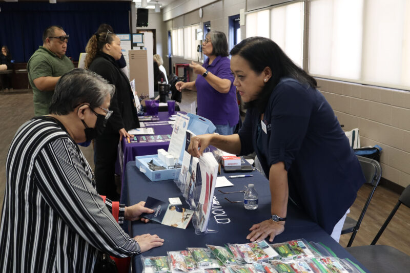 Norma Unson (L) gets information from Mara Gonzalez (R) at the Our Lady of Perpetual Help Health & Wellness Fair at OLPH in Newhall, Calif., Sunday, Oct. 19, 2025. Kamryn Martell/The Signal