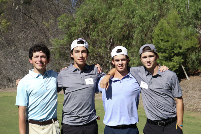 Andrew Strope (L), Alex Benavidez (CL), Cam Zanier (CR), and Myles Starr (R) smile for the camera at the College of the Canyons' "Swing for Students' Success" annual golf tournament at Valencia Country Club in Valencia, Calif., Monday, Oct. 20, 2025. Kamryn Martell/The Signal