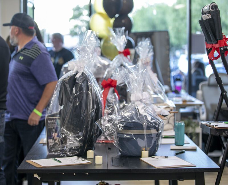Guests could participate in a silent auction during the third annual Finally Family Homes Poker Tournament at the Oasis Resource Center on Saturday, Oct. 18, 2025. Habeba Mostafa/ The Signal