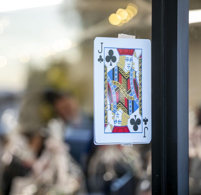 Playing cards were displayed outside of the Oasis Resource Center during the third annual Finally Family Homes Poker Tournament at the Oasis Resource Center on Saturday, Oct. 18, 2025. Habeba Mostafa/ The Signal