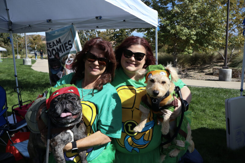 Lisa Henderson (L), Guido (L), Lauren Henderson (R) and Jasper (R) dress up as "Teenage Mutant Ninja Turtles" at the American Cancer Society's Bark For Life "Howl-O-Ween" event at the Canyon Country Community Center in Canyon Country, Calif., Sunday, Oct. 26, 2025. Kamryn Martell/The Signal