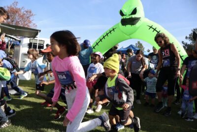 Children begin the 1K kids run at the "Finish the Ride and Finish the Run" event at West Creek Park in Valencia, Calif., Sunday, Oct. 26, 2025. Kamryn Martell/The Signal