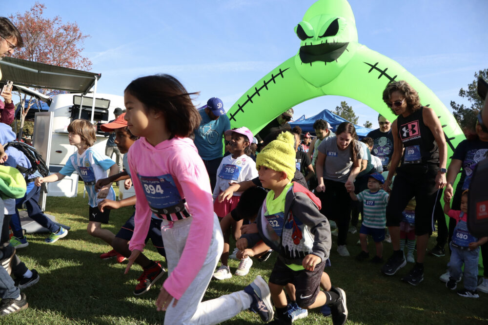Children begin the 1K kids run at the "Finish the Ride and Finish the Run" event at West Creek Park in Valencia, Calif., Sunday, Oct. 26, 2025. Kamryn Martell/The Signal