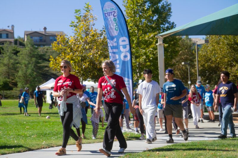 OCD Walk co-chairs Annie Barker (left) and Kjersti Helberg lead 150 people to begin the OCD Walk at Fair Oaks Part on Oct. 18, 2025. Katherine Quezada/The Signal