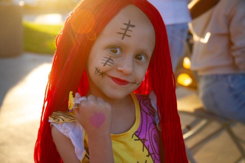 Nairi Mahsaradjian, 4, shows off her hand painting she received during the Halloween Fiesta hosted by the city of Santa Clarita at the Newhall Community Center on Oct. 24, 2025. Katherine Quezada/The Signal