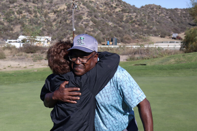Nancy Butler (L) hugs Dwight Harris (R), Air Force and Space Force veteran, at the 12th annual Thank-A-Veteran golf tournament at the Sand Canyon Country Club in Canyon Country, Calif., Monday, Oct. 27, 2025. Kamryn Martell/The Signal
