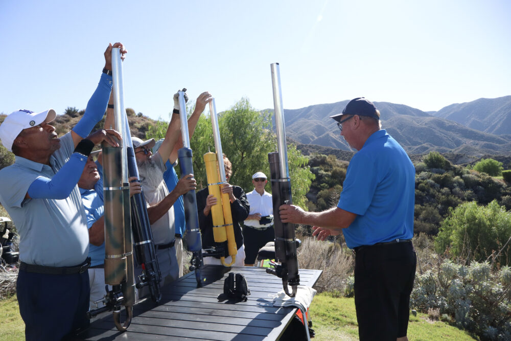 Attendees load up the air cannons with their golf balls at the 12th annual Thank-A-Veteran golf tournament at the Sand Canyon Country Club in Canyon Country, Calif., Monday, Oct. 27, 2025. Kamryn Martell/The Signal