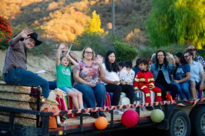 Families take a ride on the Hayride during the Church of the Canyons Fall Festival in Sand Canyon on Oct. 18, 2025.