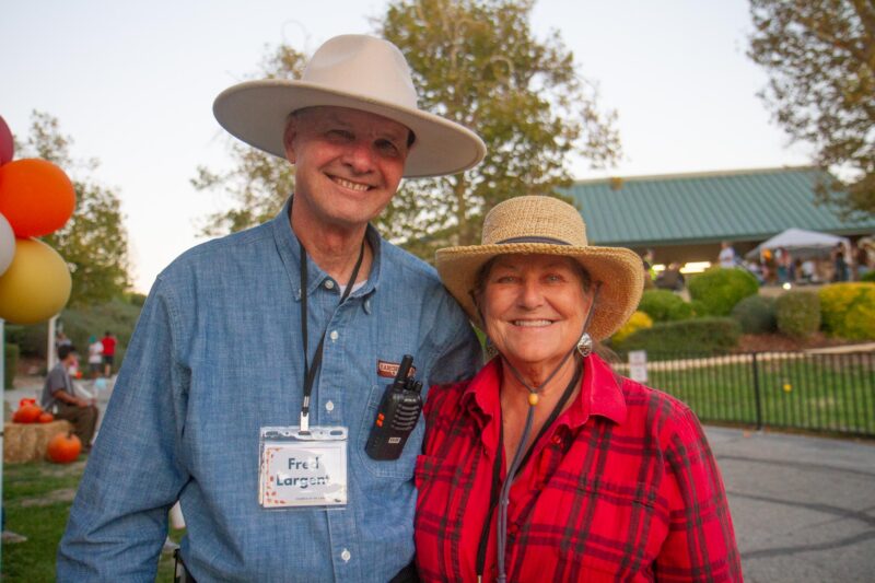 Church members and volunteers Fred Largent (left) and his wife Mary Largent at the Church of the Canyos Fall Festival in Sand Canyon on Oct. 18, 2025. Katherine Quezada/The Signal