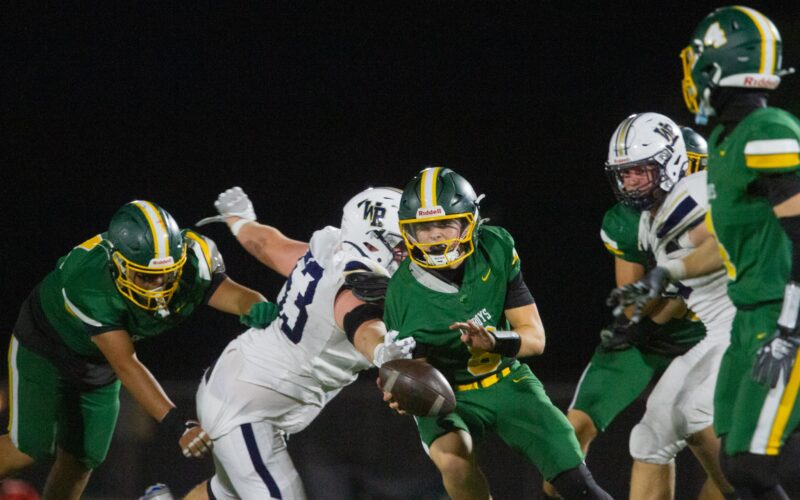 Canyon quarterback Carson Soria (8) struggles to pass the ball as West Ranch makes contact during Friday’s game on Oct. 31, 2025 at Canyon. Katherine Quezada/The Signal