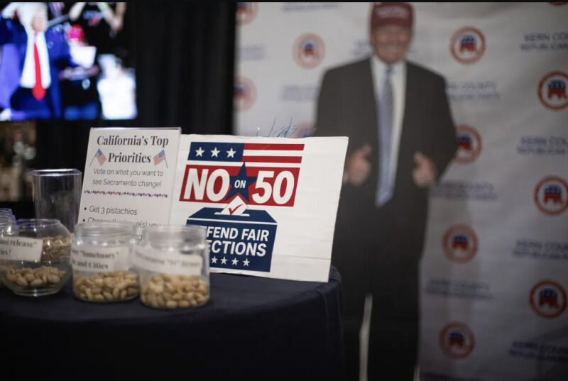 A “No on Prop 50” sign at the Kern County Republican Party booth at the Kern County Fair in Bakersfield on Sept. 26, 2025. Photo by Larry Valenzuela, CalMatters/CatchLight Local