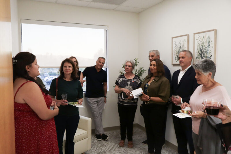 Attendees mingle in the room at the SMO "Adopt-A-Family" kickoff celebration at the SMO offices in Valencia, Thursday, Oct. 30, 2025. Kamryn Martell/The Signal