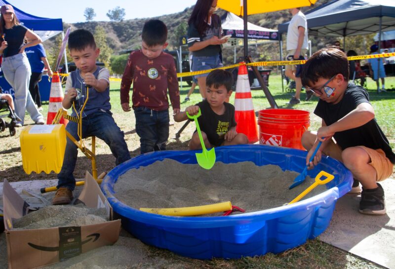 Children pretend play as SoCalGas technicians seeking “gas lines” using tools during the fourth annual Touch-a-Truck hosted by the Santa Clarita Valley Education Foundation at Central Park in Saugus on Nov. 1, 2025. Katherine Quezada/The Signal