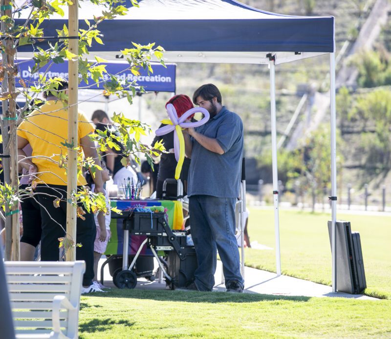 Children could have balloon art of their choosing during the opening of Riparian Park in Valencia by FivePoint on Saturday, Nov. 1, 2025. Habeba Mostafa/ The Signal