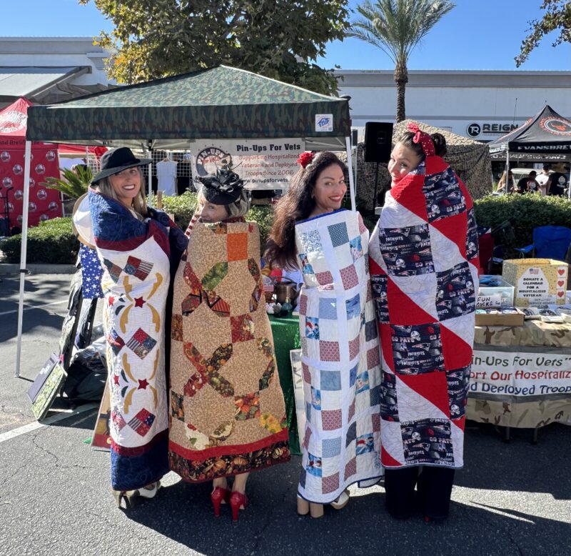 From left to right: LeahAnn Sweeney, a Marines veteran, Alicia Corona, a Navy veteran, Rachel Jannusch, a Marine veteran, and Ilia Banks, a Marines veteran pose with their "Quilts of Valor." Photo courtesy of Ilia Banks.